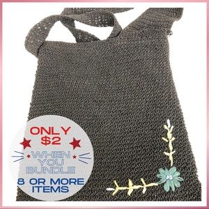 Woven crossbody with lovely flower accent